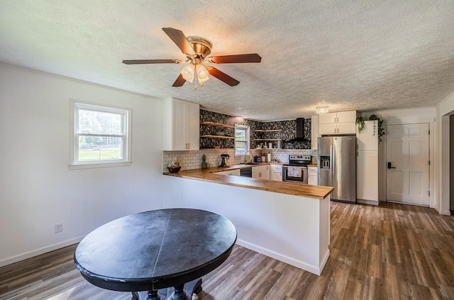 13 Thomas, Williamston, SC 29697 - kitchen with stainless steel appliances, wood counters, open shelves, a textured ceiling, and a peninsula