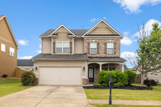 415 Bridge Xing, Simpsonville, SC 29681 - view of front of property featuring a garage, concrete driveway, brick siding, and covered porch
