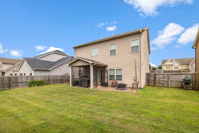 415 Bridge Xing, Simpsonville, SC 29681 - rear view of property featuring a sunroom, a fenced backyard, a patio area, and a fire pit