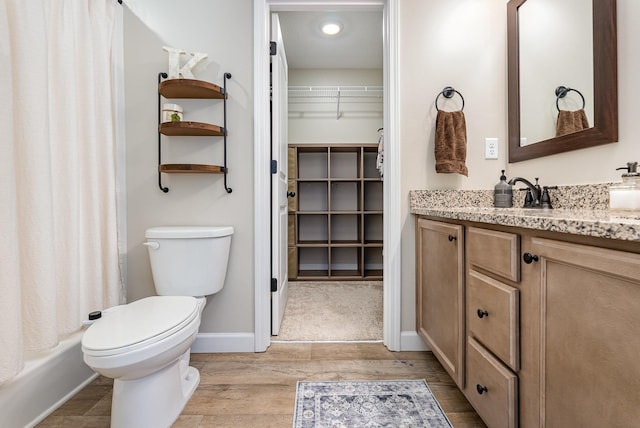 307 Burdell, Inman, SC 29349 - bathroom featuring vanity, wood finished floors, a spacious closet, and shower / tub combo with curtain