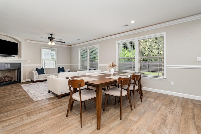 307 Burdell, Inman, SC 29349 - dining space featuring ornamental molding, light wood-style floors, a premium fireplace, a ceiling fan, and recessed lighting