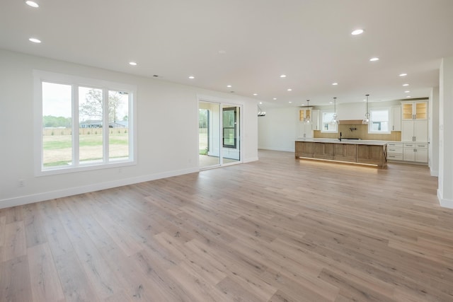 3617 Pennington, Greer, SC 29651 - unfurnished living room with light wood-style flooring and recessed lighting