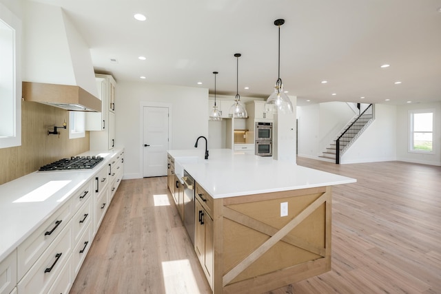 3617 Pennington, Greer, SC 29651 - kitchen with appliances with stainless steel finishes, light wood finished floors, recessed lighting, light countertops, and a large island