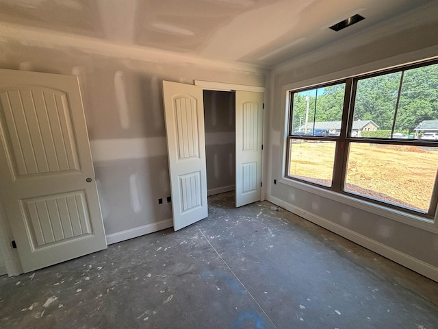 129 Worthmore, Gaffney, SC 29340 - unfurnished bedroom featuring unfinished concrete flooring and a closet