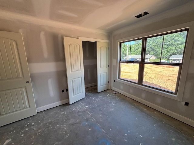 129 Worthmore, Gaffney, SC 29340 - unfurnished bedroom with concrete flooring and a closet