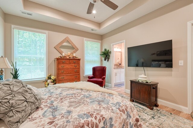 119 W Caylee, Chesnee, SC 29323 - bedroom with wood finished floors, ensuite bathroom, a tray ceiling, and ceiling fan