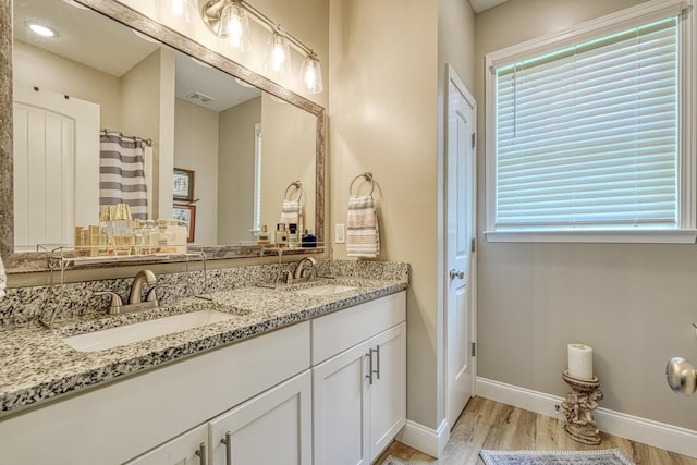 119 W Caylee, Chesnee, SC 29323 - full bathroom featuring wood finished floors, double vanity, and plenty of natural light