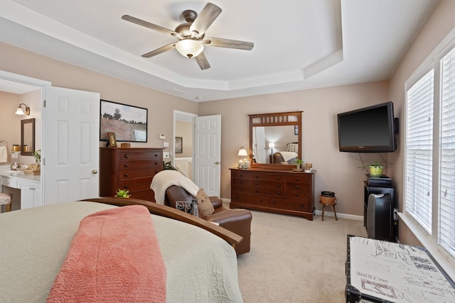 514 Collingsworth, Greenville, SC 29615 - bedroom featuring a tray ceiling, light carpet, multiple windows, and a ceiling fan