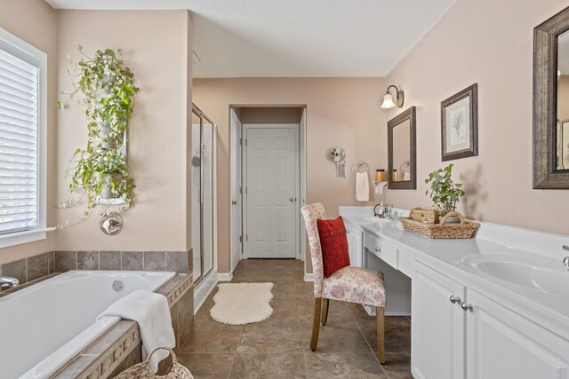 514 Collingsworth, Greenville, SC 29615 - full bathroom featuring double vanity, a garden tub, and a shower stall