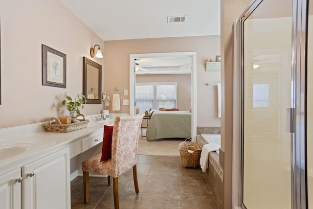 514 Collingsworth, Greenville, SC 29615 - bathroom with double vanity, a garden tub, ceiling fan, a stall shower, and ensuite bathroom