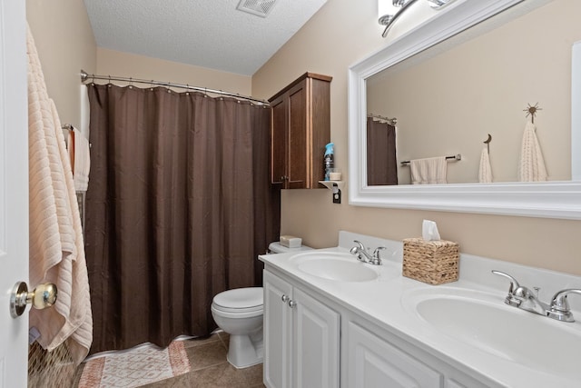 514 Collingsworth, Greenville, SC 29615 - full bathroom featuring double vanity, a textured ceiling, tile patterned floors, and curtained shower