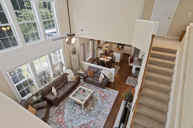 514 Collingsworth, Greenville, SC 29615 - living area featuring stairs, a towering ceiling, wood finished floors, and a ceiling fan