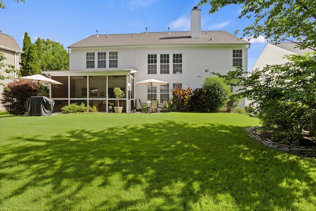 514 Collingsworth, Greenville, SC 29615 - back of house with a sunroom, a lawn, and a chimney