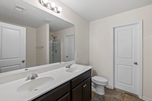 714 Cremello, Moore, SC 29369 - bathroom featuring a shower with door, double vanity, and stone finish flooring