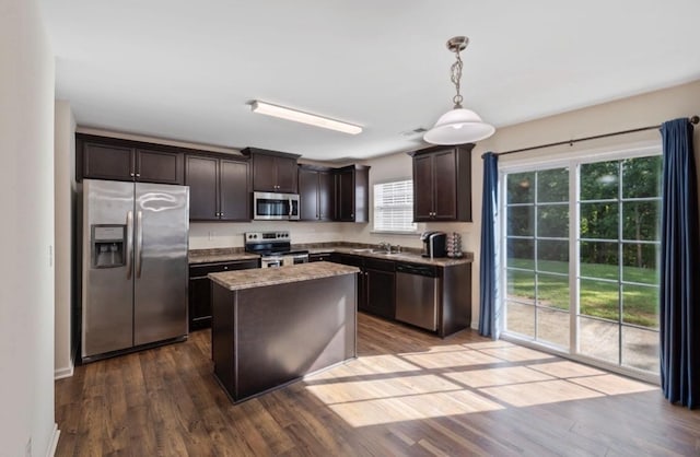 714 Cremello, Moore, SC 29369 - kitchen with stainless steel appliances, dark brown cabinets, dark wood-style flooring, a center island, and hanging light fixtures