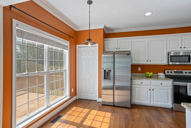 802 Wheat, Greer, SC 29651 - kitchen featuring appliances with stainless steel finishes, ornamental molding, white cabinets, dark wood-style floors, and hanging light fixtures