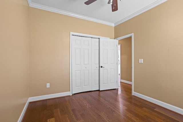 802 Wheat, Greer, SC 29651 - unfurnished bedroom featuring crown molding, dark wood finished floors, a closet, and ceiling fan