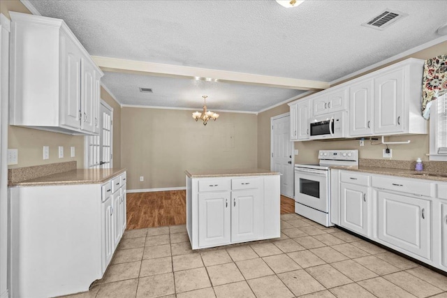 298 Askew, Union, SC 29379 - kitchen with white appliances, white cabinets, a textured ceiling, a chandelier, and a kitchen island