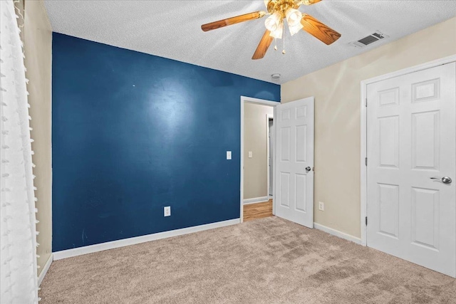298 Askew, Union, SC 29379 - unfurnished bedroom with a textured ceiling, carpet, and a ceiling fan