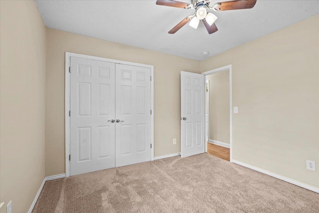 298 Askew, Union, SC 29379 - unfurnished bedroom with carpet flooring, a closet, a textured ceiling, and a ceiling fan