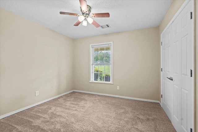 298 Askew, Union, SC 29379 - unfurnished bedroom featuring carpet flooring, a textured ceiling, a closet, and ceiling fan