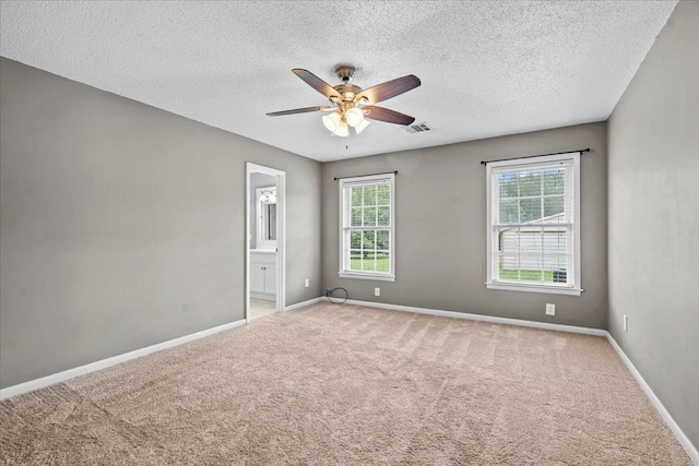 298 Askew, Union, SC 29379 - spare room featuring plenty of natural light, carpet, ceiling fan, and a textured ceiling