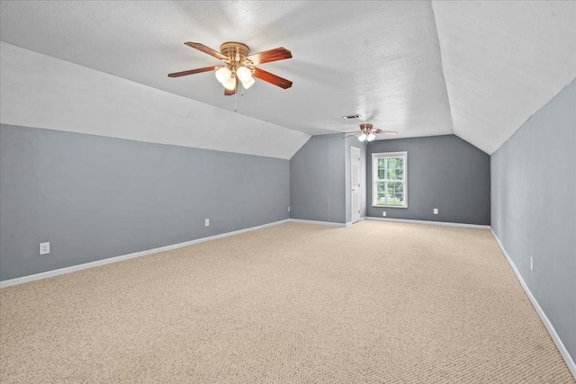 298 Askew, Union, SC 29379 - additional living space featuring a ceiling fan, light carpet, lofted ceiling, and a textured ceiling