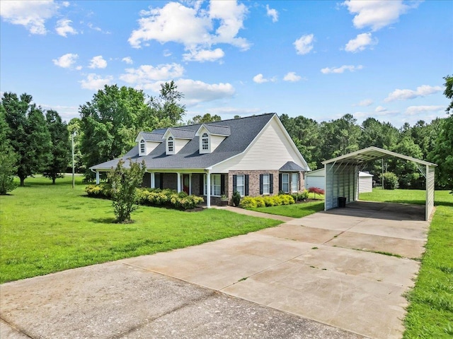 298 Askew, Union, SC 29379 - cape cod home with a detached carport, a front yard, concrete driveway, brick siding, and a porch