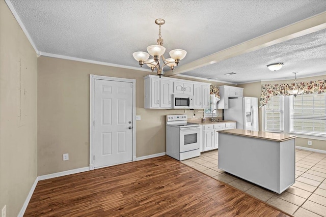 298 Askew, Union, SC 29379 - kitchen with white appliances, a chandelier, a textured ceiling, wood finished floors, and a kitchen island
