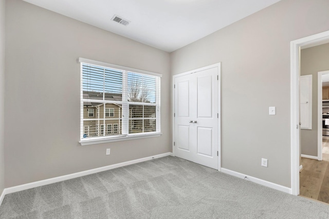 463 Lynnell, Moore, SC 29369 - unfurnished bedroom featuring carpet and a closet