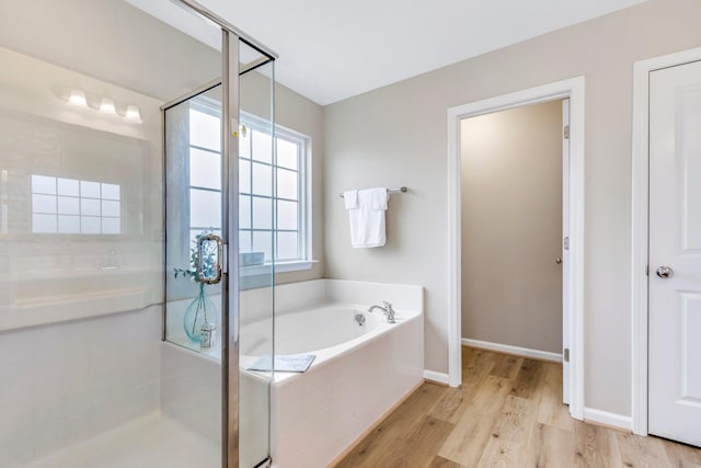 463 Lynnell, Moore, SC 29369 - bathroom with a stall shower, a bath, and wood finished floors