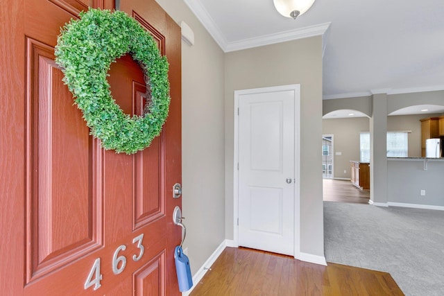 463 Lynnell, Moore, SC 29369 - carpeted entryway featuring arched walkways, crown molding, and wood finished floors