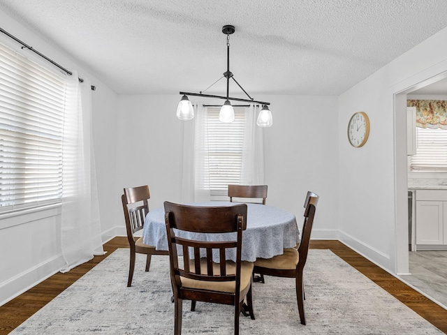 129 Spring, Reidville, SC 29375 - dining space with a textured ceiling and dark wood-type flooring