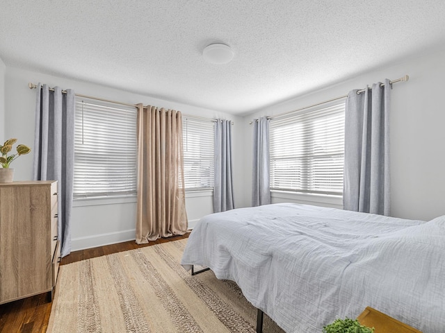 129 Spring, Reidville, SC 29375 - bedroom with wood finished floors and a textured ceiling