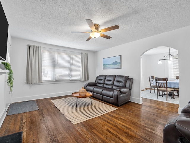 129 Spring, Reidville, SC 29375 - living area with arched walkways, ceiling fan, wood finished floors, and a textured ceiling