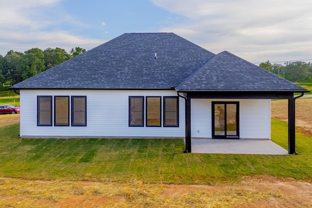 634 N Green Riv, Gaffney, SC 29341 - rear view of house with roof with shingles, a patio, and a lawn