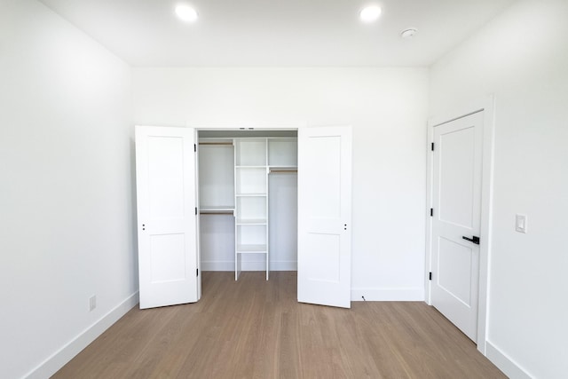 634 N Green Riv, Gaffney, SC 29341 - unfurnished bedroom with wood finished floors, recessed lighting, and a closet