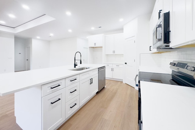 634 N Green Riv, Gaffney, SC 29341 - kitchen featuring stainless steel appliances, light wood-type flooring, recessed lighting, an island with sink, and tasteful backsplash