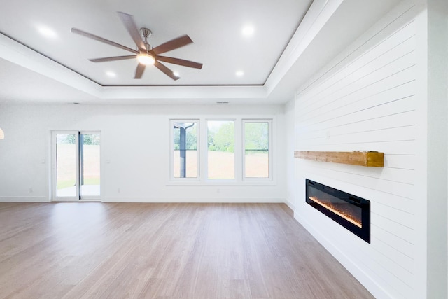 634 N Green Riv, Gaffney, SC 29341 - unfurnished living room with a glass covered fireplace, a raised ceiling, wood finished floors, ceiling fan, and recessed lighting