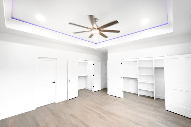634 N Green Riv, Gaffney, SC 29341 - unfurnished bedroom with a raised ceiling, light wood finished floors, two closets, recessed lighting, and a ceiling fan