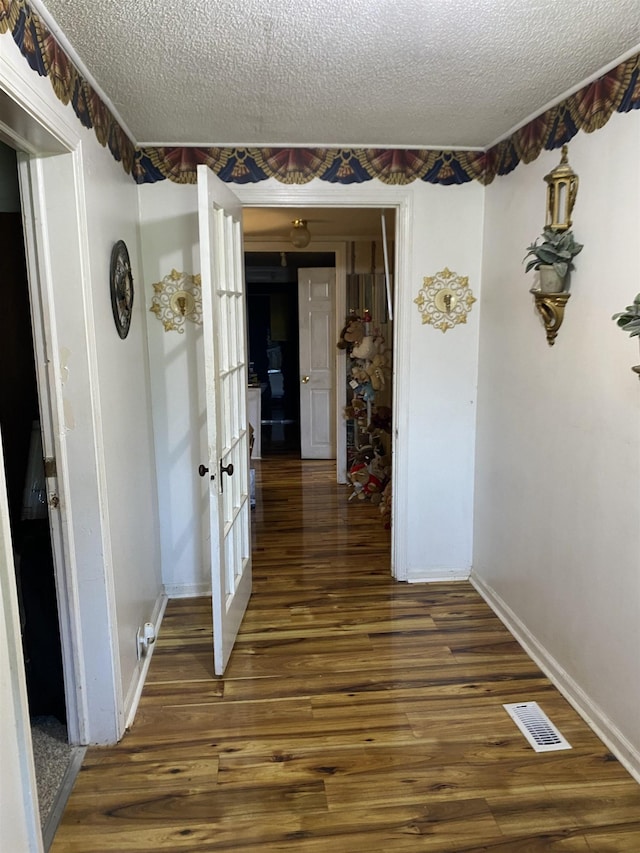 414 W Buford, Gaffney, SC 29340 - hall with a textured ceiling, wood finished floors, and french doors