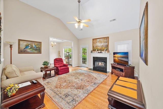 232 N Hamlet, Moore, SC 29369 - living area with a ceiling fan, light wood-type flooring, a fireplace with flush hearth, and high vaulted ceiling
