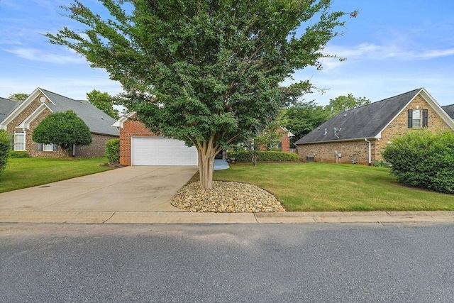 232 N Hamlet, Moore, SC 29369 - view of front facade featuring brick siding, a front yard, a garage, and concrete driveway