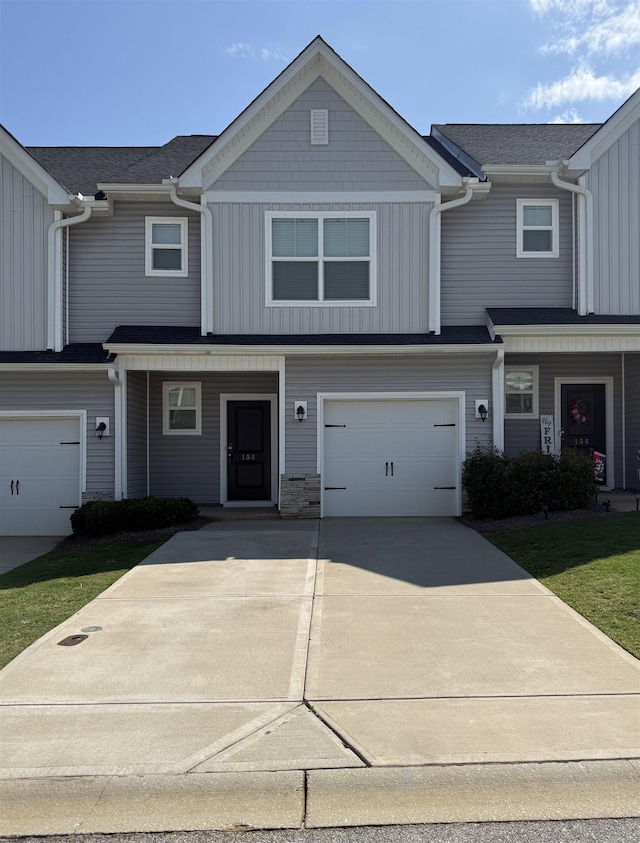 158 Clingstone, Duncan, SC 29334 - townhome / multi-family property featuring driveway, a garage, board and batten siding, and a porch