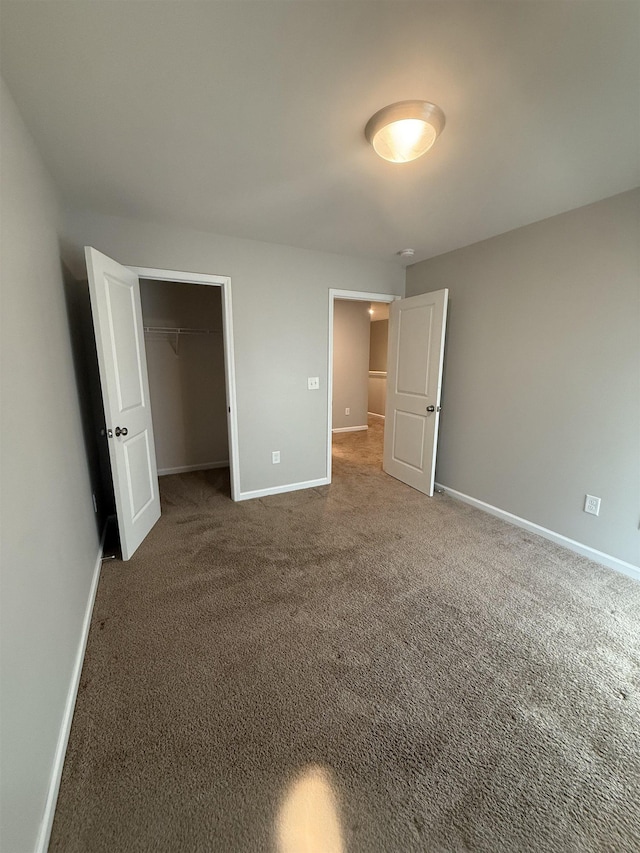 158 Clingstone, Duncan, SC 29334 - unfurnished bedroom with carpet, a walk in closet, and a closet