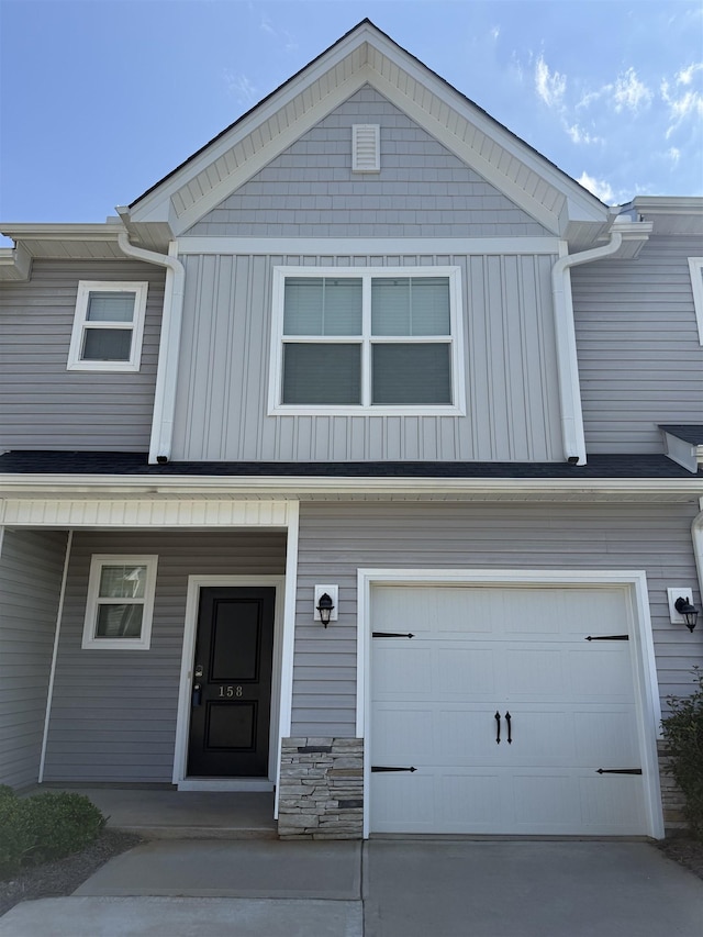 158 Clingstone, Duncan, SC 29334 - multi unit property featuring a garage, board and batten siding, concrete driveway, and a porch
