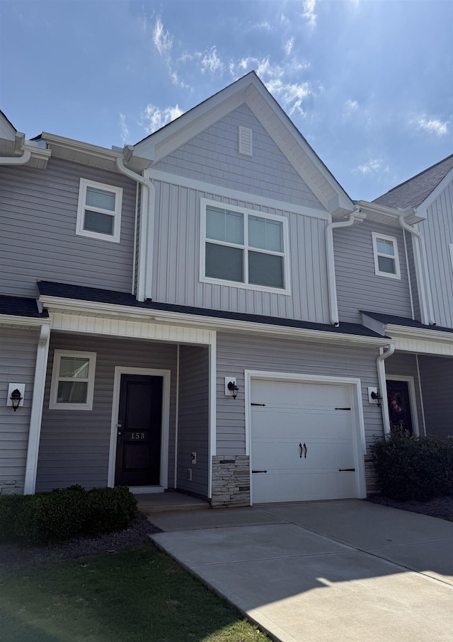 158 Clingstone, Duncan, SC 29334 - view of property featuring a garage, board and batten siding, and concrete driveway