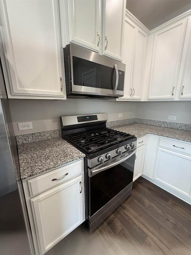 158 Clingstone, Duncan, SC 29334 - kitchen with appliances with stainless steel finishes, white cabinets, light stone counters, and dark wood-style floors