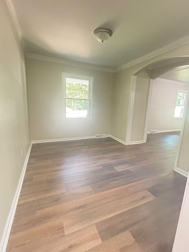 201 Bent Creek Dr, Greer, SC 29650 - empty room featuring arched walkways, dark wood-style floors, and ornamental molding