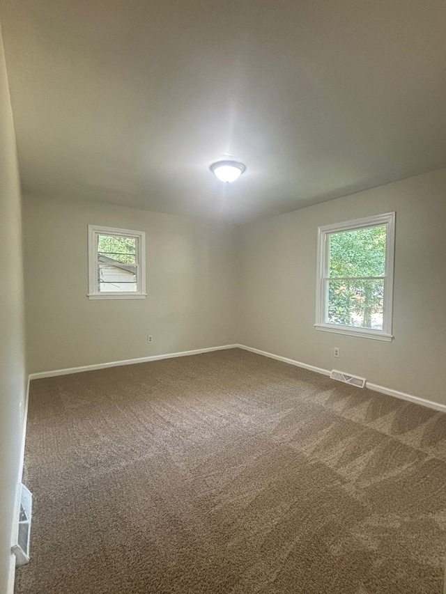 201 Bent Creek Dr, Greer, SC 29650 - spare room featuring baseboards and dark colored carpet